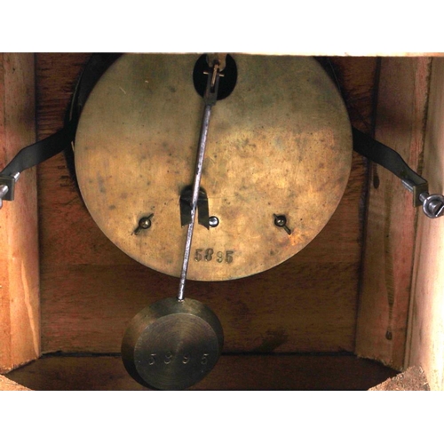 185 - A mahogany and ebonised cased mantel clock with white enamel dial and Roman numerals, 8 1/2