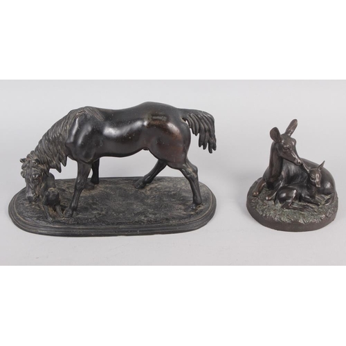 191 - A bronzed model of a horse with a dog, on oval base, 8