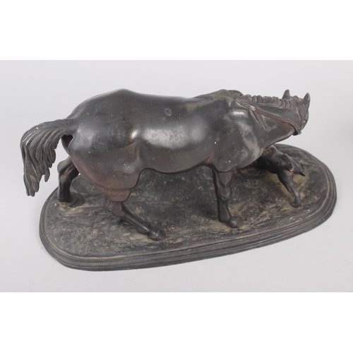 191 - A bronzed model of a horse with a dog, on oval base, 8