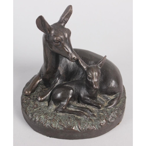 191 - A bronzed model of a horse with a dog, on oval base, 8