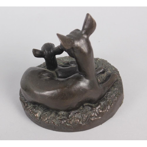 191 - A bronzed model of a horse with a dog, on oval base, 8