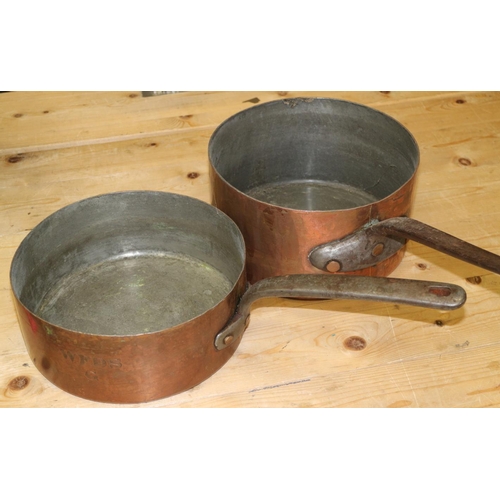 195 - Two 19th century copper saucepans with wrought iron handles, 10