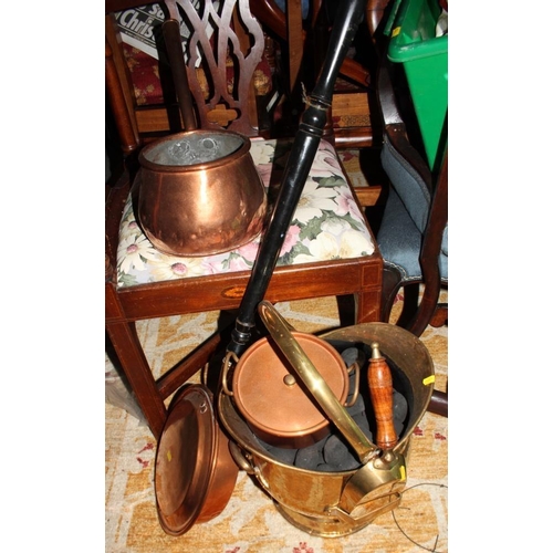 201 - A brass helmet coal scuttle, a copper warming pan, a copper saucepan and lid, a brass bell and an Ed... 