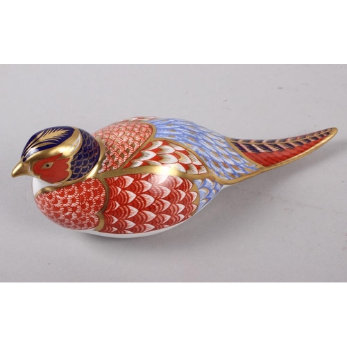 21 - A pair of Royal Crown Derby paperweights, modelled as pheasants, gold stoppers, a similar paperweigh... 