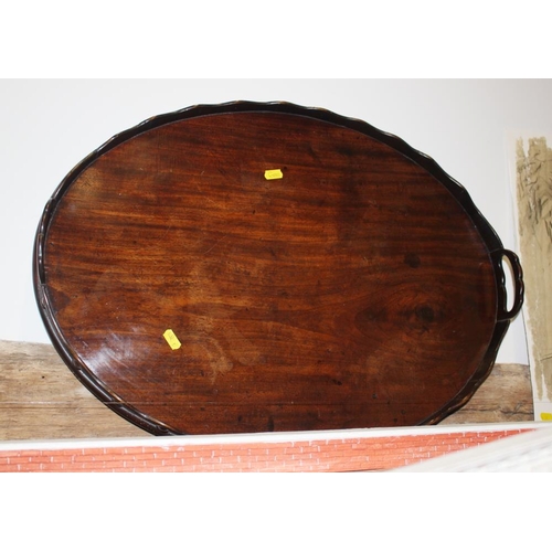 222 - A 19th century mahogany oval two-handle gallery tray with split acorn decoration, 25 1/2