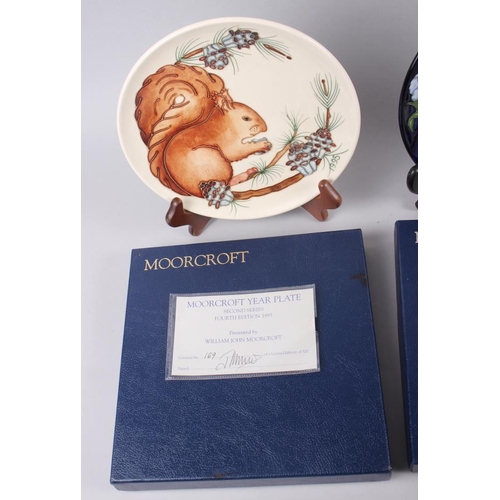 23 - A Moorcroft edition Centennial plate and two Moorcroft year plates, 1995 and a 1996 boxed