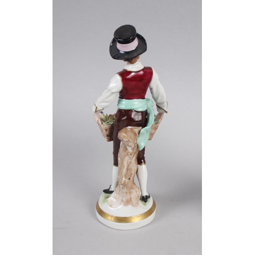 232 - A 19th century Meissen figure of a child with a goat, on oval base, 6