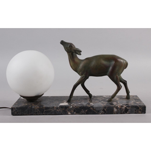 281 - An Art Deco Limousin table lamp with deer and globe, on marble base, 12 1/2