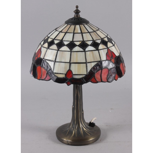 282 - An Art Nouveau design table lamp with leaded glass shade, 14