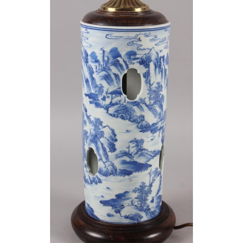 283 - A Chinese blue and white cylinder vase with pierced and landscape decoration (now converted as a tab... 