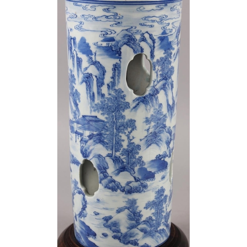 283 - A Chinese blue and white cylinder vase with pierced and landscape decoration (now converted as a tab... 