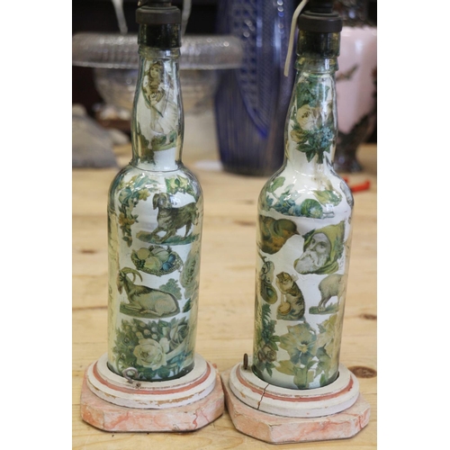 288 - A pair of Victorian transfer decorated glass bottles, now converted to table lamps, 13