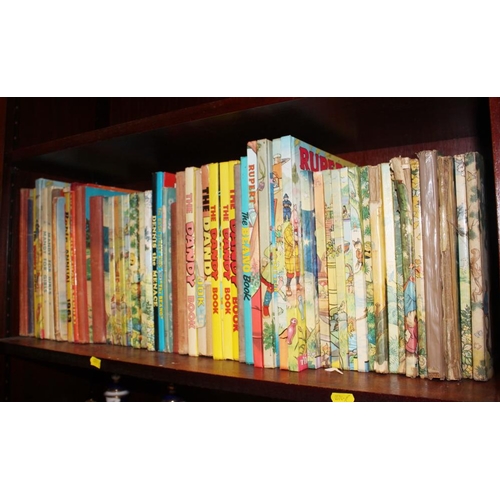 303 - A collection of Rupert Annuals, including a 1958 copy, and other annuals including Beano, Dandy and ... 