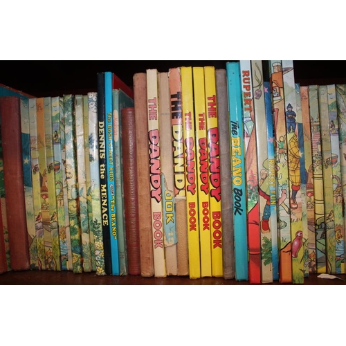 303 - A collection of Rupert Annuals, including a 1958 copy, and other annuals including Beano, Dandy and ... 