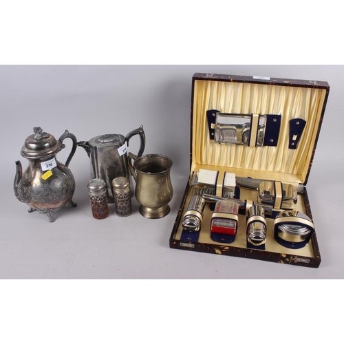 308 - A pair of silver plated shakers with blue glass liners, a water jug, a coffee pot, a tankard and a g... 