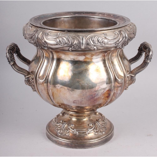 318 - A silver plated two-handled wine cooler with embossed decoration, 9