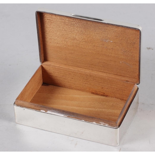 325 - A rectangular engine turned silver table cigarette box, lid engraved 