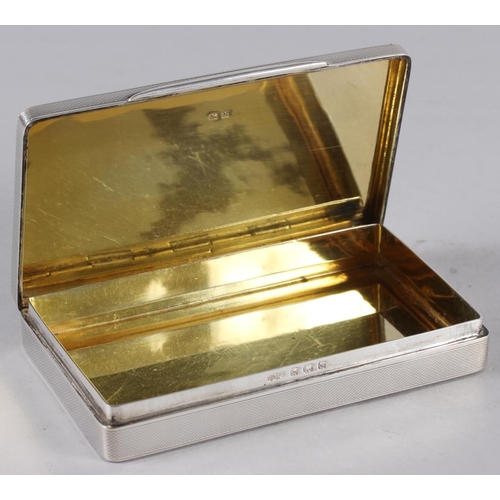 326 - A rectangular solid silver engine turned table cigarette box, 9oz troy approx, Birmingham 1937