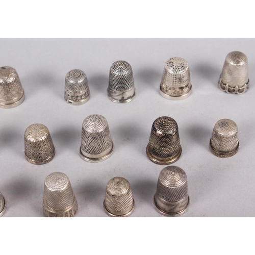 329 - A collection of approximately twenty-eight silver thimbles, by Charles Horner and others