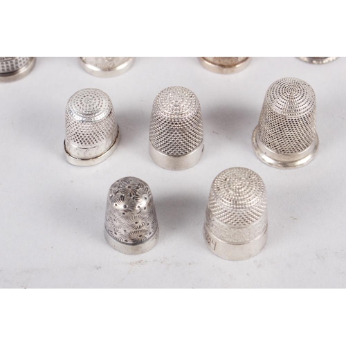 329 - A collection of approximately twenty-eight silver thimbles, by Charles Horner and others