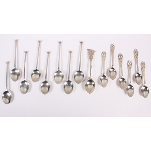 332 - A set of six silver coffee spoons with pierced handles, a set of eight silver teaspoons one other sp... 