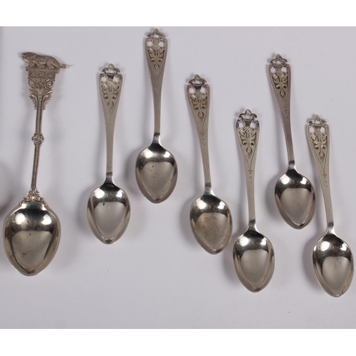 332 - A set of six silver coffee spoons with pierced handles, a set of eight silver teaspoons one other sp... 