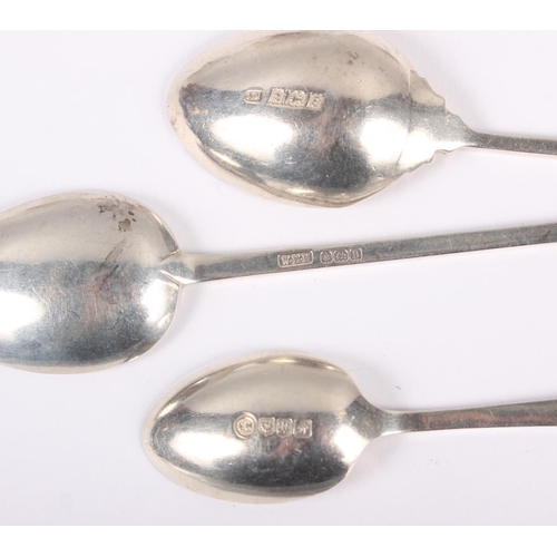 332 - A set of six silver coffee spoons with pierced handles, a set of eight silver teaspoons one other sp... 