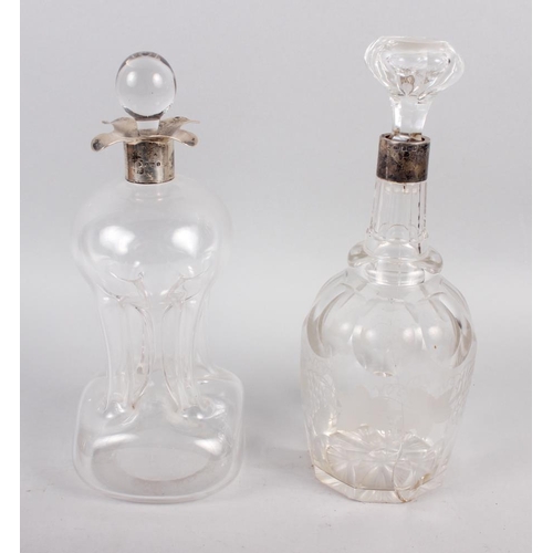 335 - A silver mounted hourglass decanter and stopper, and a Victorian cut glass decanter with silver moun... 