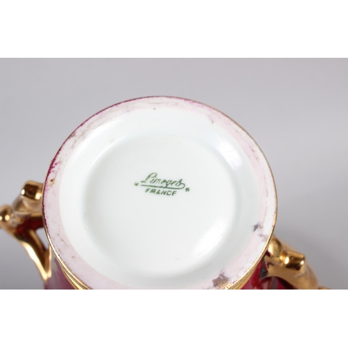 34 - A Limoges two handle cabinet cup, saucer and cover with gilt decoration and crimson ground, 7