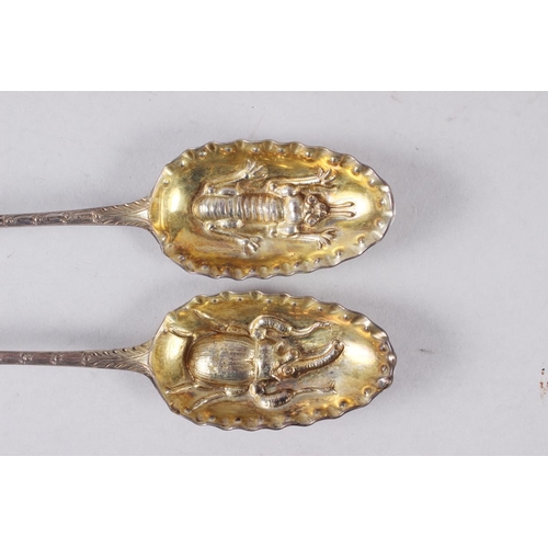 341 - A pair of Georgian silver bottom marked serving spoons with later pierced, engraved and embossed bee... 