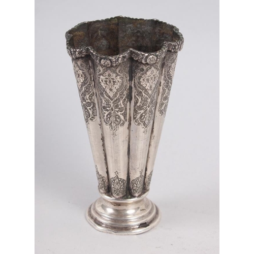 345 - A Middle Eastern white metal fluted vase with engraved decoration, 5 1/4