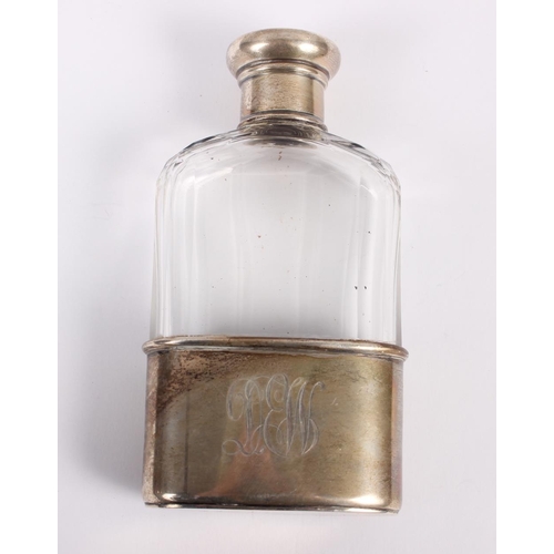 347 - A cut glass spirit flask with silver removable cup and silver lid