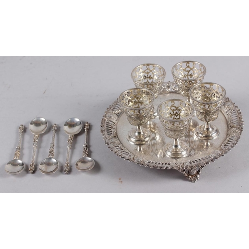 352 - A Victorian silver five-piece egg cruet, on stand, with engraved and pierced decoration, and five si... 