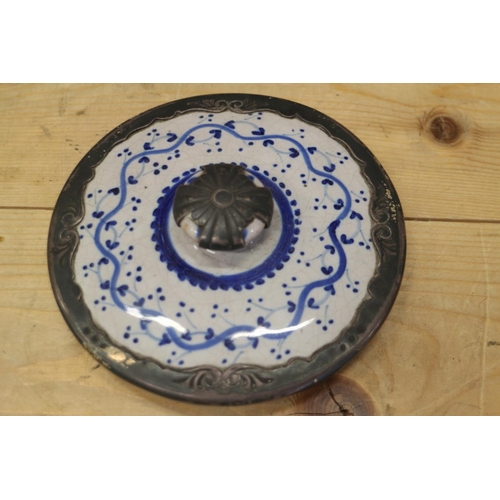 37 - An 18th century Delft ware two handled posset pot and associated cover with white metal mounts, 8 1/... 