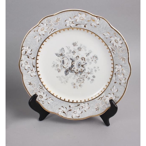 4 - A pair of Rockingham porcelain dessert plates with grey and gilt decorated floral borders and centra... 