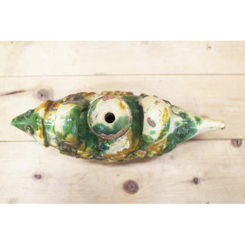 41 - An Ottoman ceramic bottle, formed as a fish, with ochre and green splashed glaze, 11 1/2