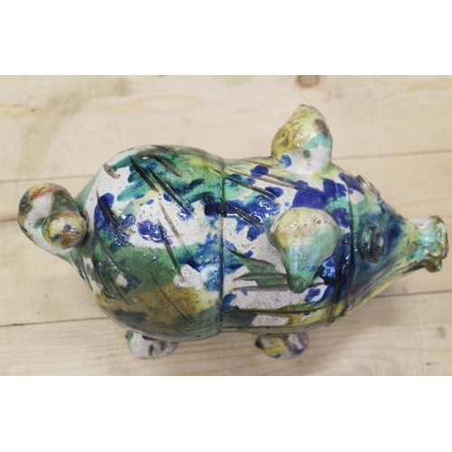 43 - An Italian majolica pig with splashed decoration, 10