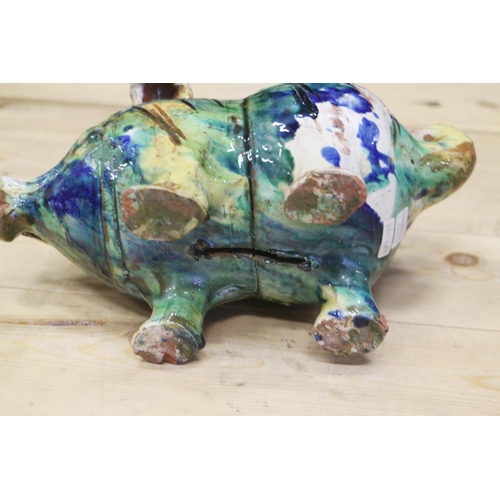 43 - An Italian majolica pig with splashed decoration, 10