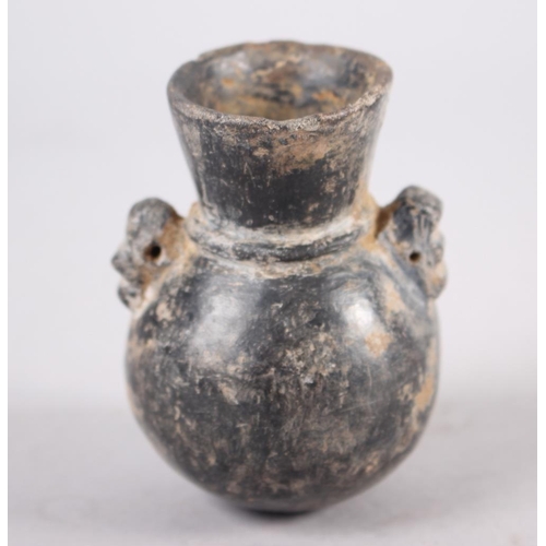 47 - A pre-Columbian pottery wine ewer and a similar miniature oil jar