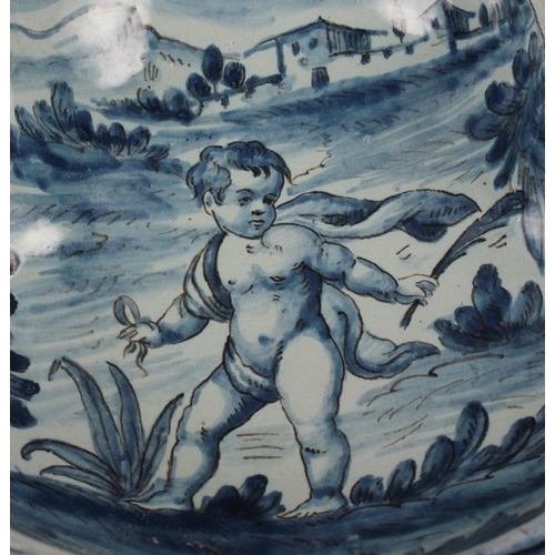 48 - A pair of 19th century Cantagalli blue and white painted dishes with putto decoration (restored)