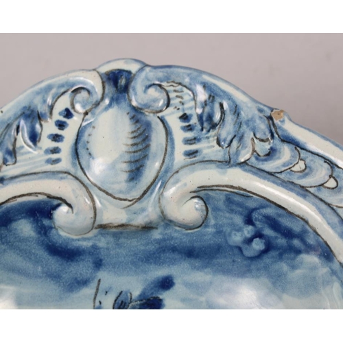 48 - A pair of 19th century Cantagalli blue and white painted dishes with putto decoration (restored)