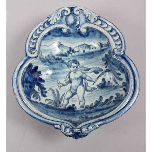 48 - A pair of 19th century Cantagalli blue and white painted dishes with putto decoration (restored)