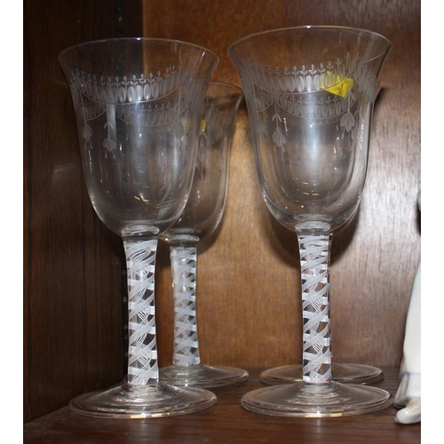 60 - A pair of Venetian enamel decorated wine glasses with octagonal bowls, 6