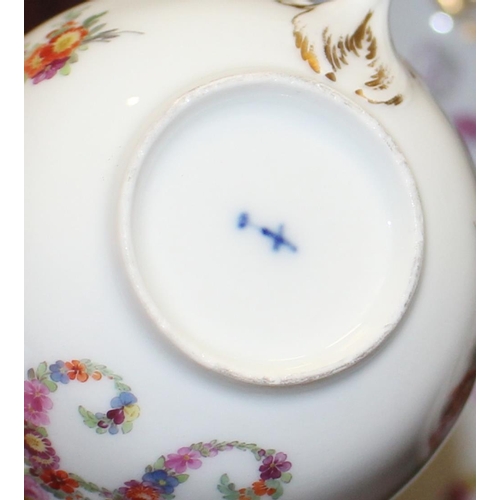 69 - A Berlin porcelain floral decorated part teaset (damages)