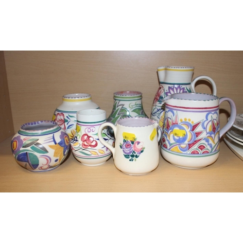 71 - Four assorted Poole pottery jugs and four similar vases, tallest jug 9