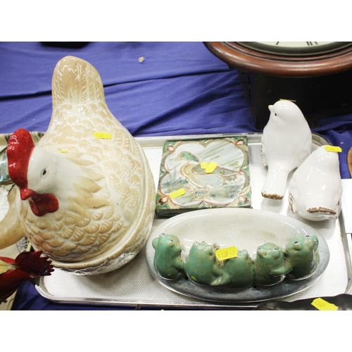 80 - A hen egg crock, two ceramic birds, a duck tile and a group of five frogs