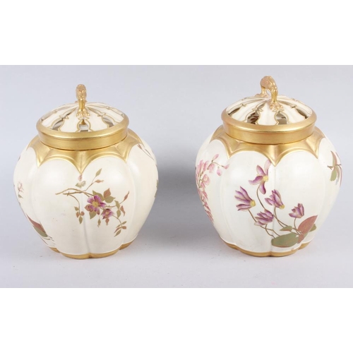 85 - A Royal Worcester blush ivory pot pourri pot and cover and a similar companion, 7 1/2