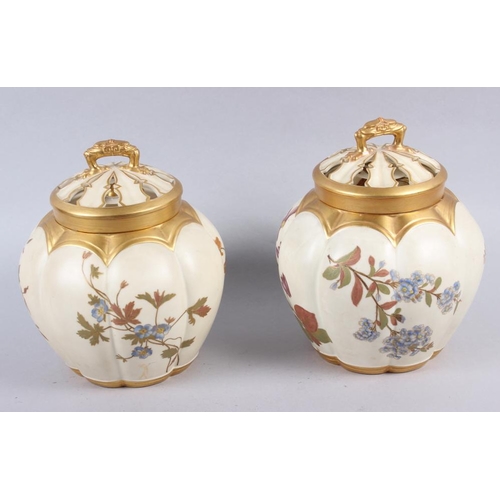 85 - A Royal Worcester blush ivory pot pourri pot and cover and a similar companion, 7 1/2