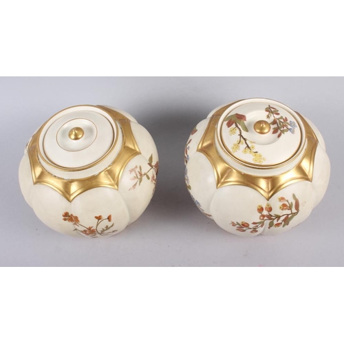 85 - A Royal Worcester blush ivory pot pourri pot and cover and a similar companion, 7 1/2