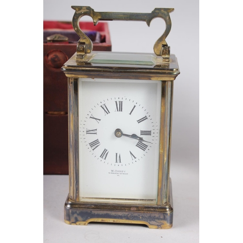 161 - A brass cased five-window carriage clock with white enamel dial and Roman numerals by W Caney, 4 1/2... 